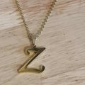 Parure collier et boucles d'oreilles lettres